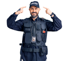 Young handsome man wearing police uniform smiling pointing to head with both hands finger, great idea or thought, good memory