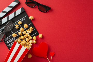 Film of Love: top view shot featuring clapperboard, 3D glasses, popcorn spilled from box, and...