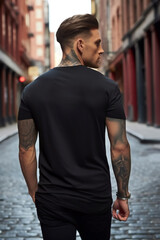 Male model in a classic black t-shirt on a city street. Vertical orientation - obrazy, fototapety, plakaty