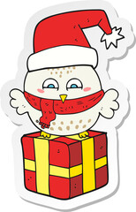 sticker of a cartoon cute christmas owl on gift