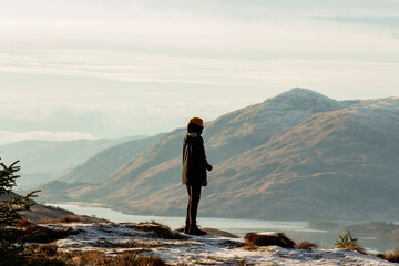Fototapeta premium person on top of mountain