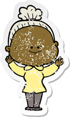 distressed sticker of a cartoon happy old woman