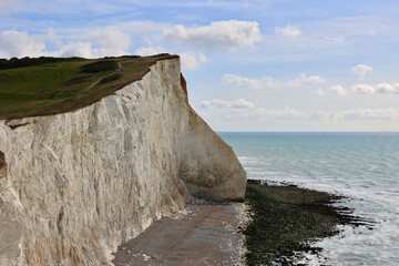 Pebble beach, cliff and coast, Seaford, East Sussex, England, UK
