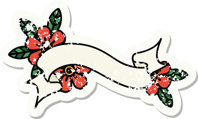 distressed sticker tattoo in traditional style of a banner and flowers