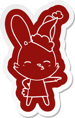 curious bunny quirky cartoon  sticker of a wearing santa hat