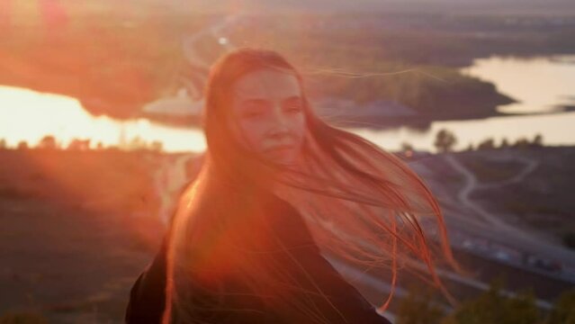 A girl dancing in the glare of the sun