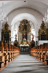 interior of a church with view on the altar and aisle