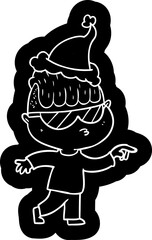 quirky cartoon icon of a boy wearing sunglasses pointing wearing santa hat