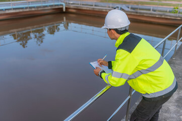 Environmental engineers work at wastewater treatment plants,Water supply engineering working at Water recycling plant for reuse