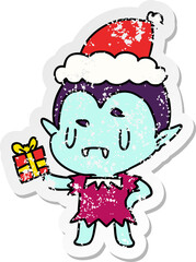 hand drawn christmas distressed sticker cartoon of kawaii vampire