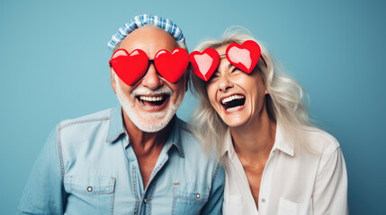 Happy couple celebrates valentine's day wearing heart-shaped glasses