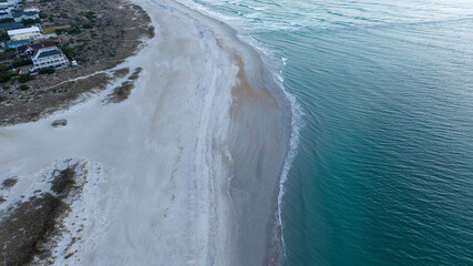 Fototapeta premium Wrightsville Beach during sunrise. Clear, blue, green water from the atlantic ocean.