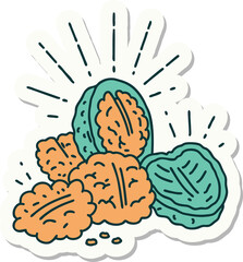 sticker of a tattoo style walnuts with shell
