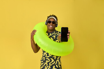 Mobile phone advertisement for an African smiling young man wearing sunglasses on a yellow...