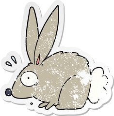 distressed sticker of a cartoon frightened rabbit