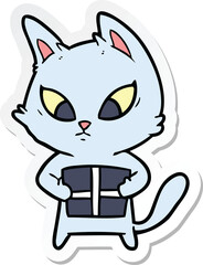 sticker of a confused cartoon cat with gift