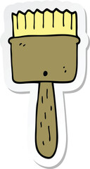 sticker of a cartoon paintbrush