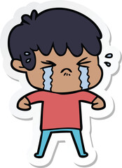 sticker of a cartoon boy crying