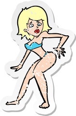 retro distressed sticker of a cartoon woman in bikini