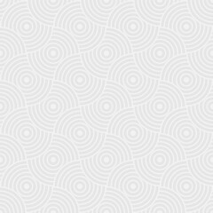Seamless trendy pattern of circles and arcs, geometric white shapes for textiles and wallpaper. Festive Christmas pattern on a gray background.