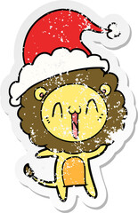 happy hand drawn distressed sticker cartoon of a lion wearing santa hat