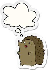 cartoon happy hedgehog with thought bubble as a printed sticker
