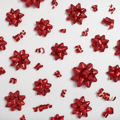 Decorative red bows and serpentine on a white background