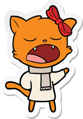 sticker of a cartoon cat in winter clothes