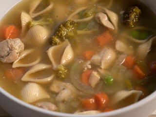 Side view of chicken noodle soup