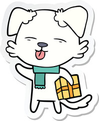 sticker of a cartoon dog with xmas gift
