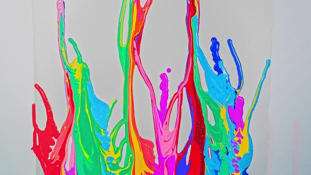 time lapse Sweet tones flowing and blending together on the white floor. 
It is a strange abstract picture.
fantasy image of dripping paint on white background.colorful of pantone color background.

