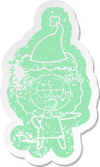 quirky cartoon distressed sticker of a bored lion wearing santa hat