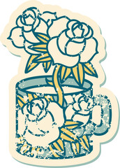 iconic distressed sticker tattoo style image of a cup and flowers