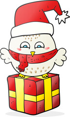freehand drawn cartoon cute christmas owl on wrapped present