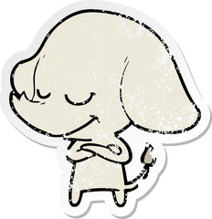 distressed sticker of a cartoon smiling elephant with crossed arms