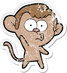 distressed sticker of a cartoon hooting monkey