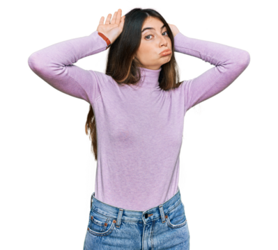 Young beautiful teen girl wearing turtleneck sweater doing bunny ears gesture with hands palms looking cynical and skeptical. easter rabbit concept.