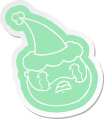 quirky cartoon  sticker of a male face with beard wearing santa hat