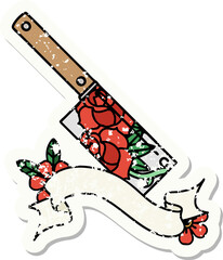 worn old sticker with banner of a cleaver and flowers