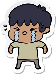 sticker of a cartoon boy crying
