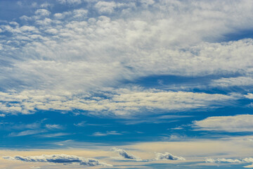 Blue sky with white blurry clouds