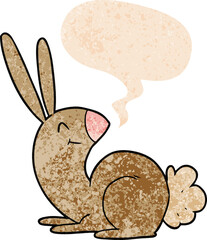 cute cartoon rabbit with speech bubble in grunge distressed retro textured style