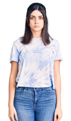 Obraz premium Young beautiful girl wearing casual t shirt depressed and worry for distress, crying angry and afraid. sad expression.
