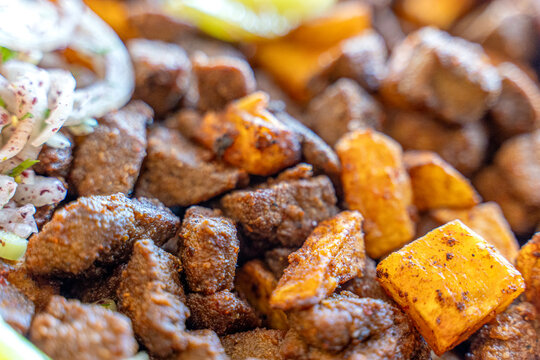 Fried liver cubes with potatoes and tomatoes Turkish name Arnavut Cigeri Turkish Traditional food albanian liver