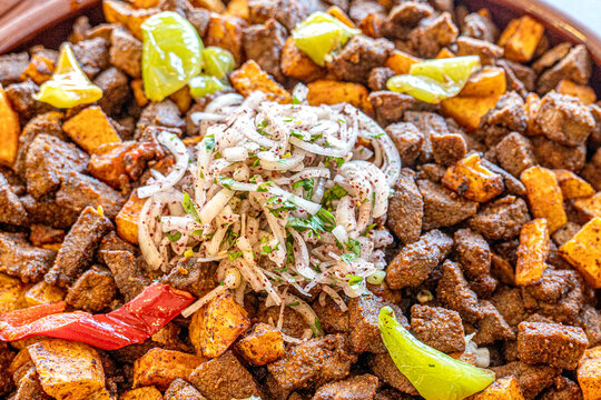Fried liver cubes with potatoes and tomatoes Turkish name Arnavut Cigeri Turkish Traditional food albanian liver