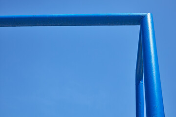 The upper right corner of the sports gate on a blue sky background