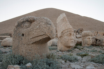 close up of the head of eagle statue and Antiochus with the tumulus of the royal tomb in the...
