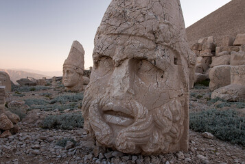 close-up of statue of Zeus's head and of Antiocchus behind on the top of  Mount Nemrut, Turkey