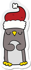 sticker of a cartoon christmas penguin