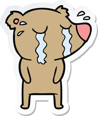 sticker of a cartoon crying bear